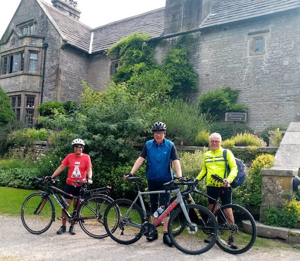 Us three cyclists in front of Hartington Hall Youth Hostel