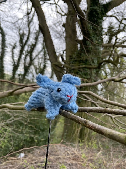 Knitted rabbit on a tree