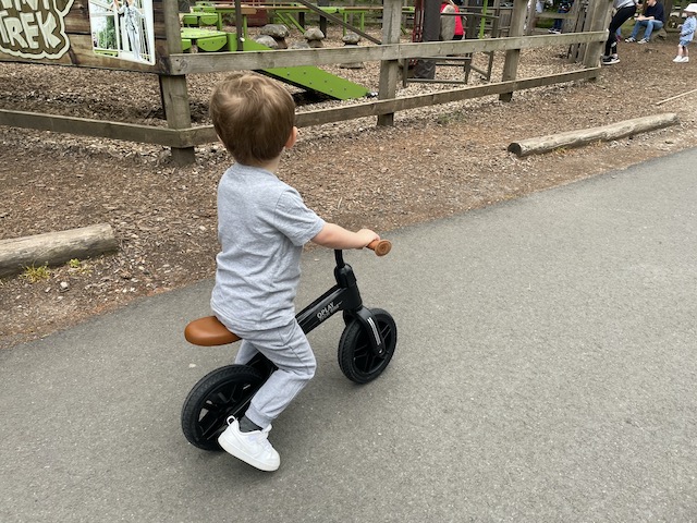 A boy on his balance bike