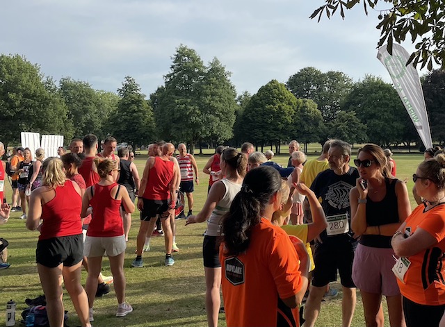 Lots of runners standing chatting in Birkenhead Park