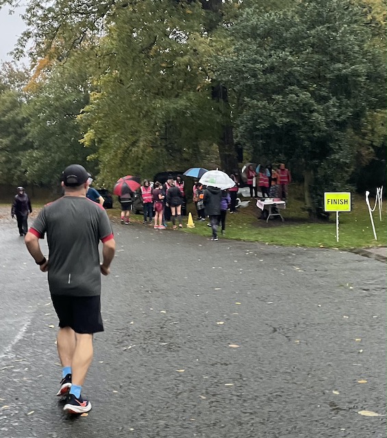 volunteers in park huddling for the briefing