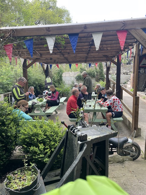 Sitting outside with the cycling group and drinking teas and coffees.