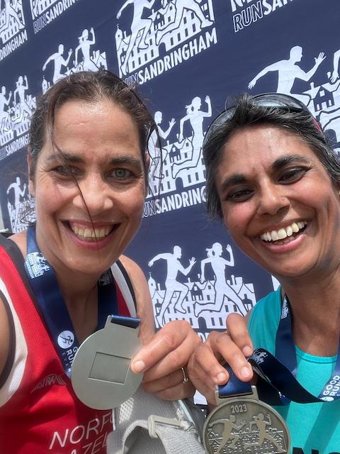Me and my friend with relieved smiles and medals.