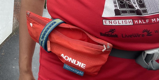 My phone pocket on my belt being held together with the parkrun wristband.