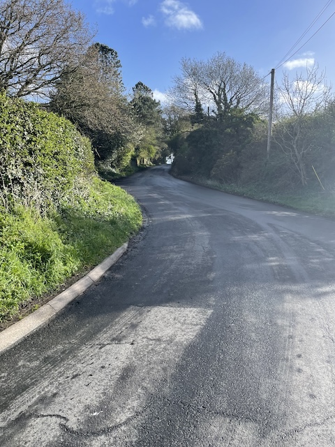 Part way up Red Hill Road with the rest of the road snaking up ahead of me.