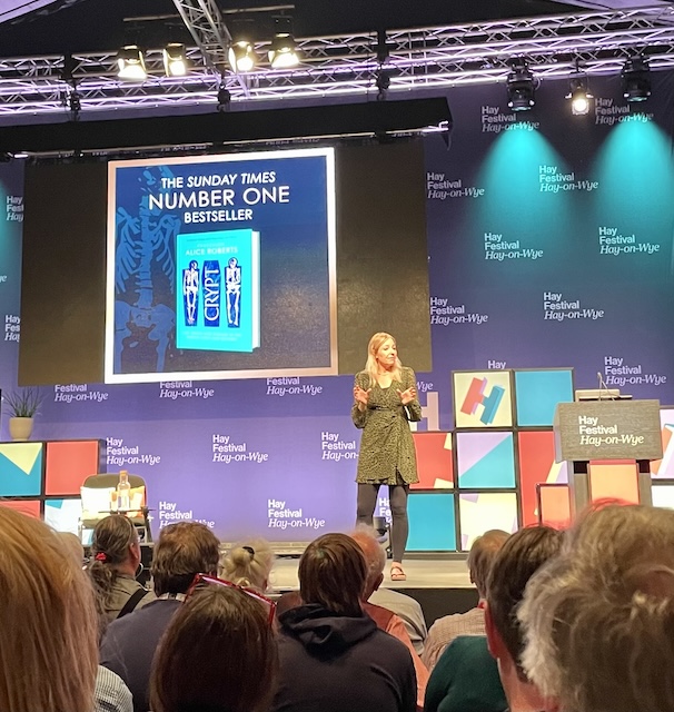 Alice Roberts holding the audience's attention all by herself on the large stage