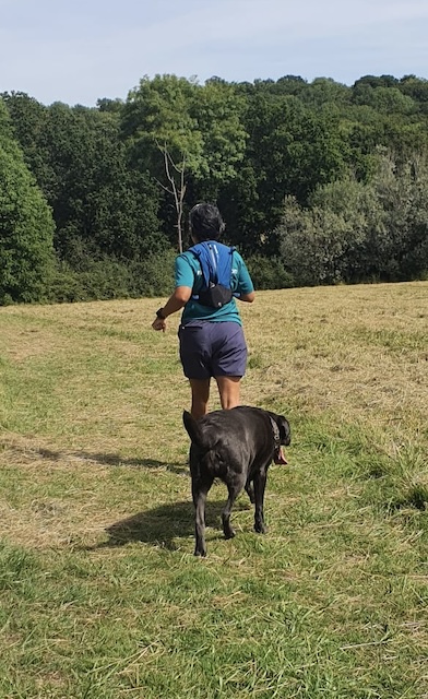 Me running on the grass with Bonnie the Labrador