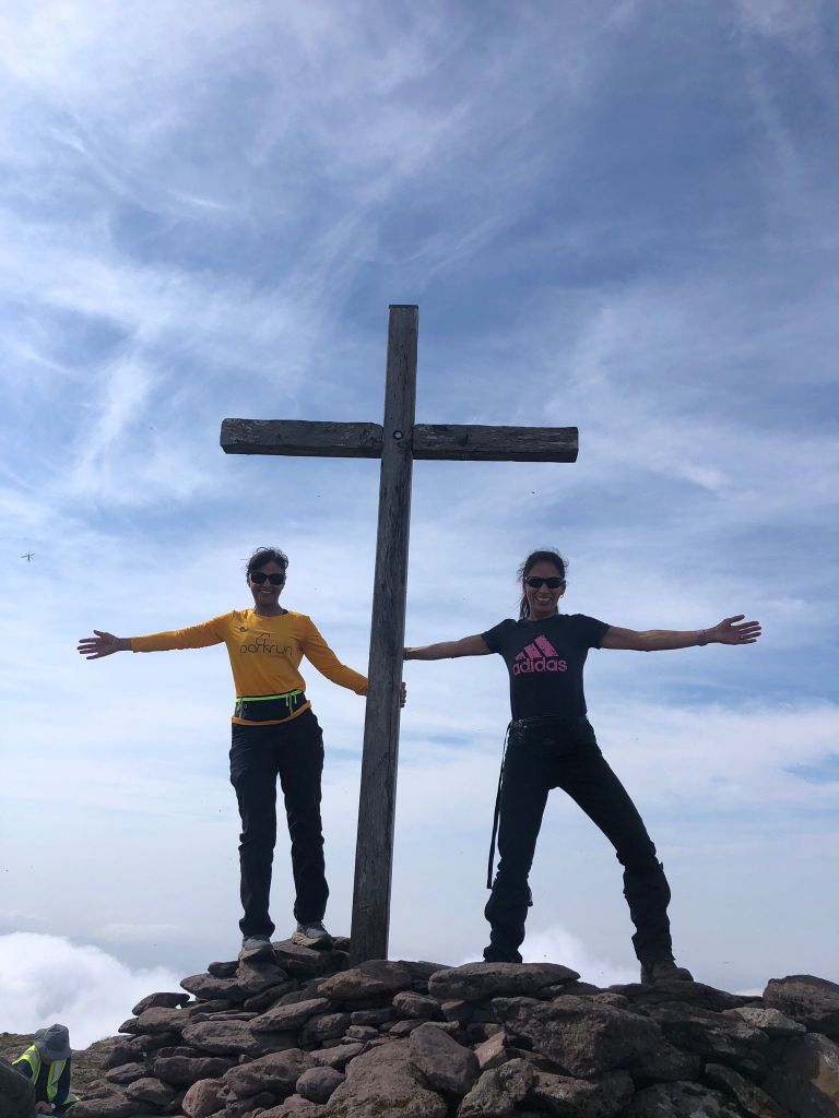 My two sisters on either side of the cross at the top of Mount Brandon.
