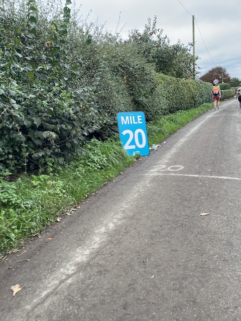 The mile twenty marker on the side of the road