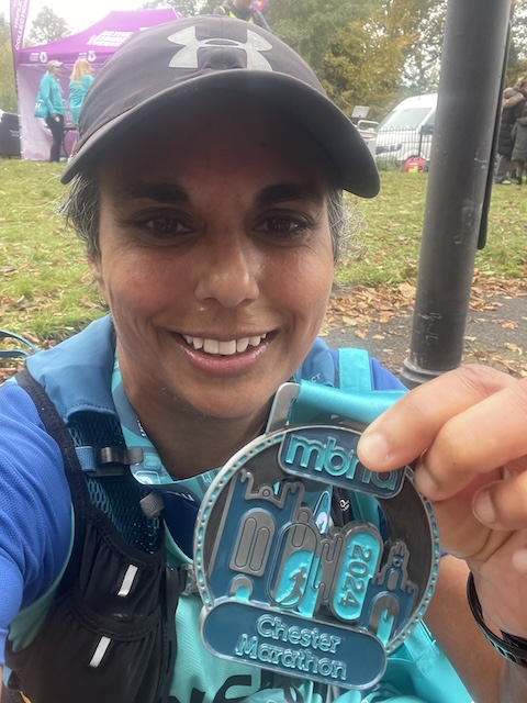 Me looking sleepy with my finisher's medal