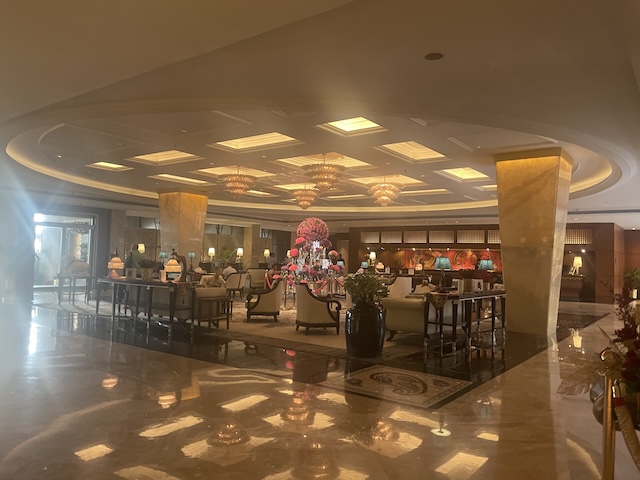 Indoors at the Taj with lights and nice chairs and tables