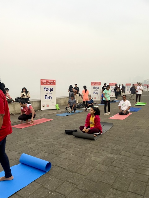 People setting up for a Yoga class on Marine Drive, now that it's daylight.