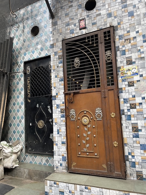 Some doorways with beautiful patterns on the doors.