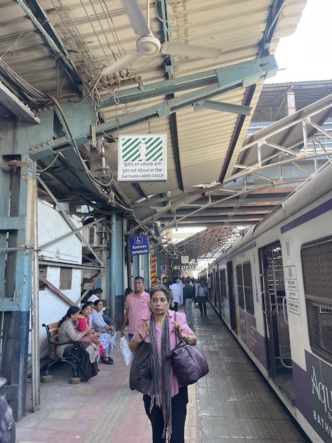 A sign on the platform saying '2nd Class Ladies Coach'