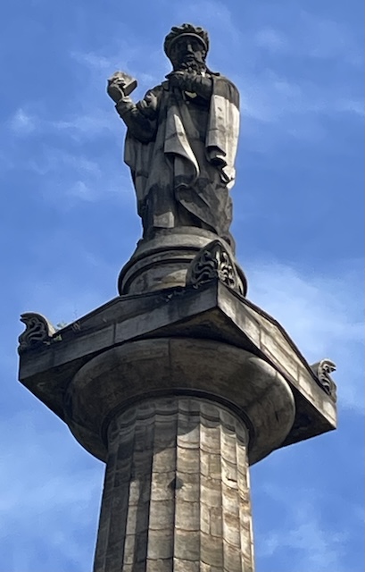 Statue of John Knox at the top of a column.