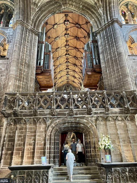 Inside of the cathedral with arch into the chancel in the front and ceiling up above