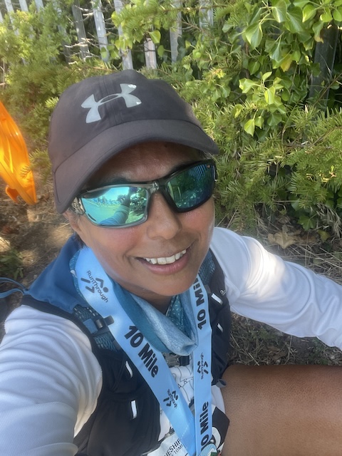 A photo of me with my medal looking a bit hot and bothered