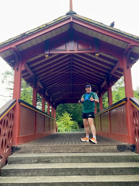 John with thumbs up on the bridge in Birkenhead Park