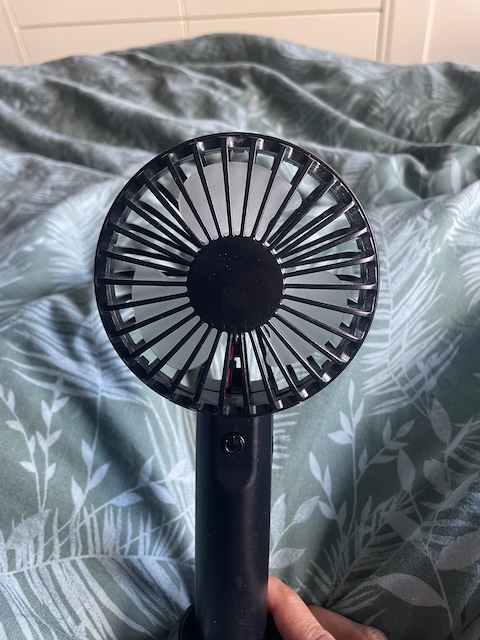 A battery-powered hand fan