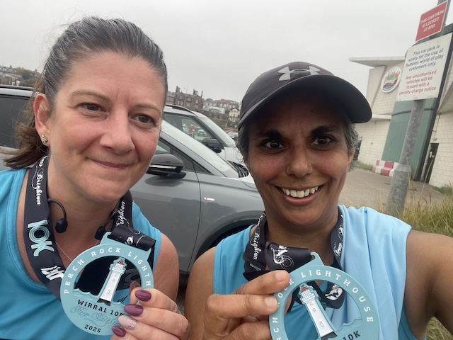 Myself and Lucy with our post race medals.
