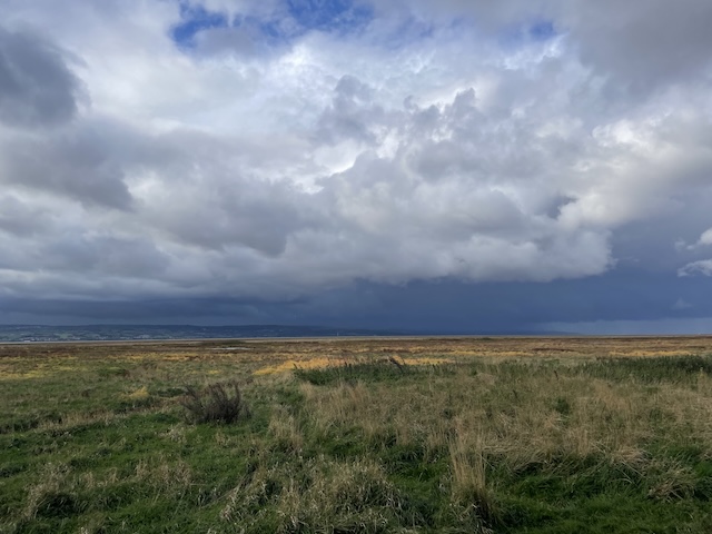 Dark clouds over Wales from our vantage on the other side of the Dee