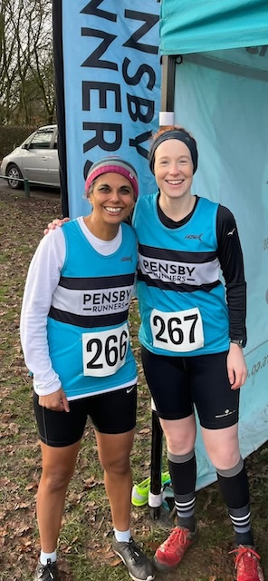 Alex and I with our club vests standing by our tent before our race.