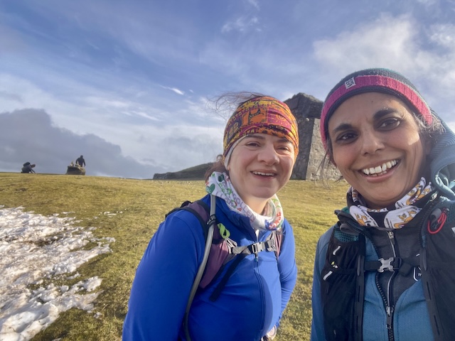 Jo and I in front of the jubilee building at the top of Moel Famau. A small patch of snow to our left but the rest of the grass is green and it is sunny!