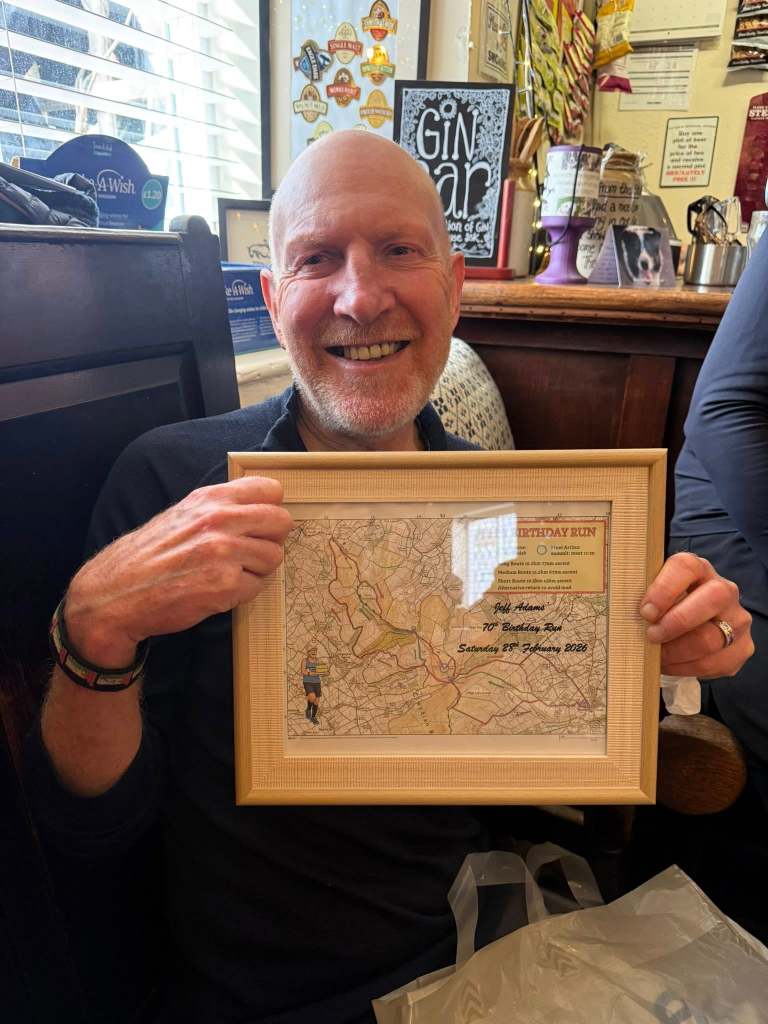 Jeff with a framed picture of the route we did.