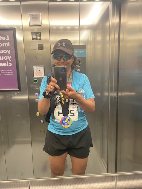 Me taking a photo of myself using the mirror in the Premier Inn lift.