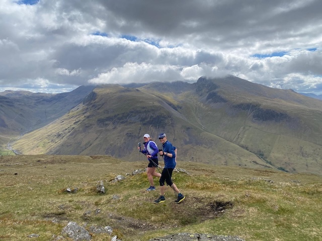 Pete and a crew member running on the tops of the Lake District